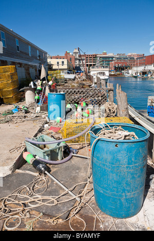 Lobster traps and fishing gear strewn around the Portland Pier in the Old Port district of Portland, Maine Stock Photo