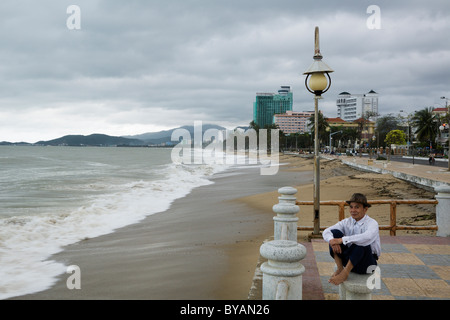 Man watching a storm by the beach in Nha Trang, Vietnam Stock Photo