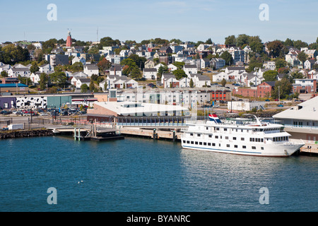 Small cruise ship docked at Ocean Gateway Terminal Visitor Information Center on Casco Bay in Portland, Maine Stock Photo