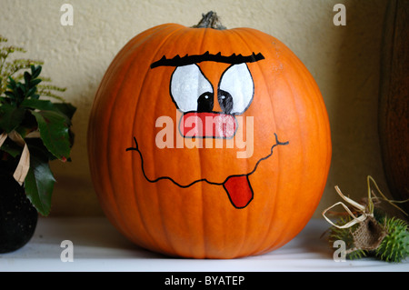 Pumpkin with a face painted on Stock Photo