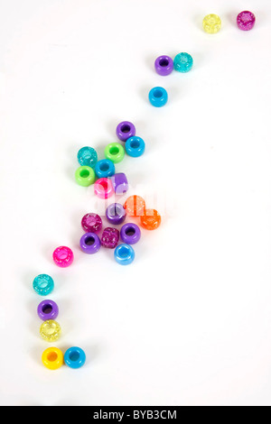 beads plastic many pieces colors colorful background scrapbook scrapbooking sparkle happy happiness fun tiny macro close up purp Stock Photo