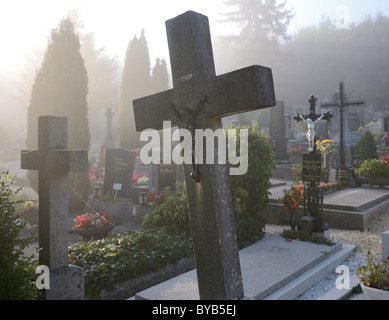 Cemetery in the morning mist, Berndorf, Triestingtal, Lower Austria, Austria, Europe Stock Photo