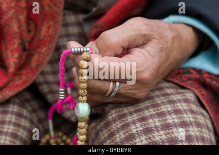 Buddhist pilgrim holding prayer beads, Thimpu, Bhutan, Asia Stock Photo