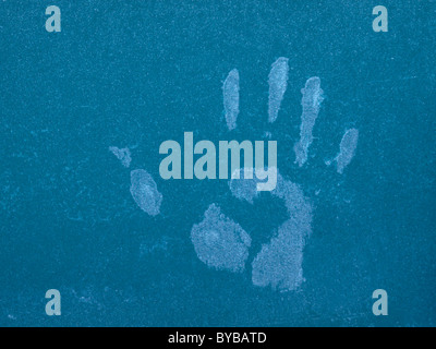 Hand print on a frozen window Stock Photo