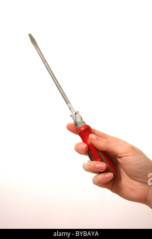 A white Caucasian female holding a pozi screwdriver on a white background also as a cut out Stock Photo