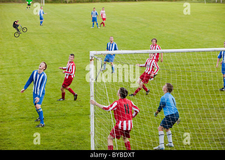 Ambleside FC playing Ulverston Town football club at Ambleside's football pitch, Lake District, UK. Stock Photo