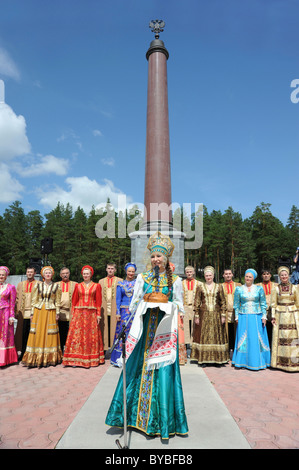 Obelisk marking the border between Europe and Asia, performance of a Russian dance company, bread as a symbol of hospitality Stock Photo