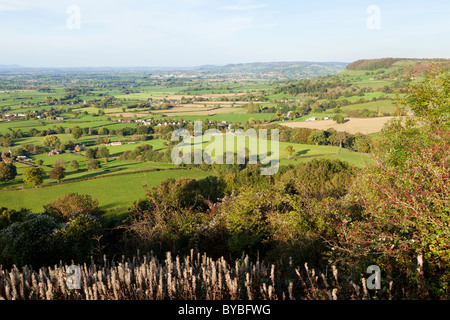 Looking north up the Severn Vale over the village of from the top of Cam Long Down, Gloucestershire Stock Photo