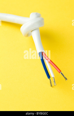 Electrical wire with yellow background Stock Photo