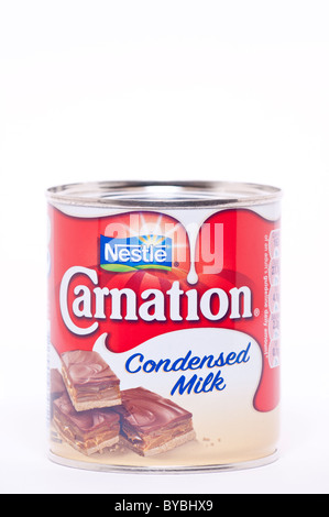 A tin of Nestle carnation condensed milk on a white background Stock Photo