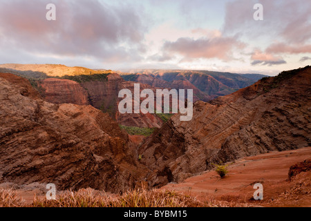 Pu'u Hina Hina Lookout at Sunset. The Canyon glows a deep red as the sun sets over this rocky canyon. Stock Photo