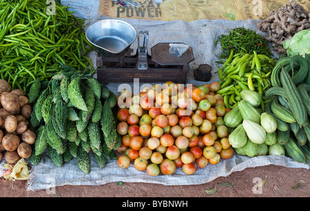 Indian vegetables and weighing scales at a rural village market, Andhra Pradesh, India. Stock Photo