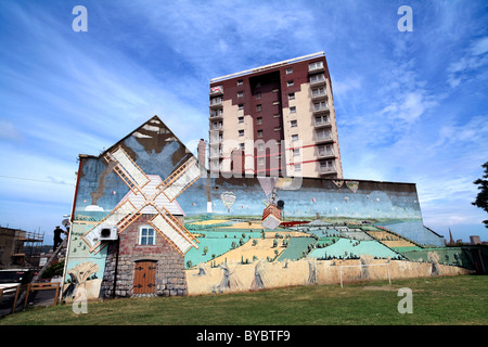 Rus in urbe? A mural of an English landscape with windmill, on the side of a building on Alfred Road, Windmill Hill, Bristol. Stock Photo