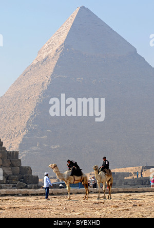 Police on camels at the Khafre pyramid, Giza in Egypt. Stock Photo