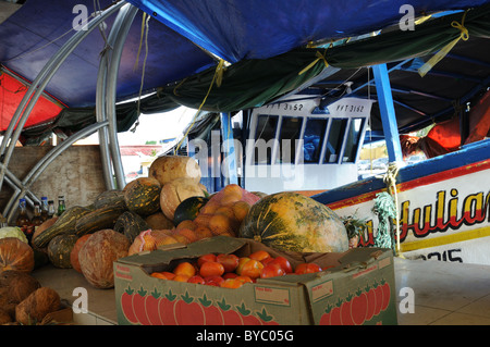 Vendors in the floating market in Willemstad, Curacao, sell produce from nearby Venezuela. Stock Photo