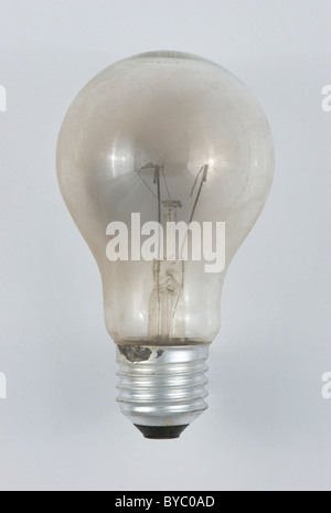 A blown incandescent light bulb, showing the broken filament. Stock Photo