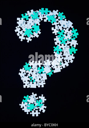 QUESTION MARK MADE WITH JIGSAW PUZZLE PIECES Stock Photo