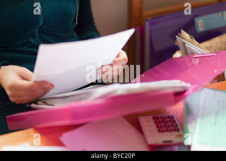 close up of a woman reading documents Stock Photo
