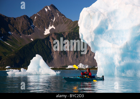 Kayaking in Bear Lagoon, Kenai Fjords National Park, near Seward, Alaska. (model released) Stock Photo