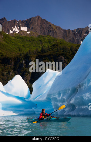 Kayaking in Bear Lagoon, Kenai Fjords National Park, near Seward, Alaska. (model released) Stock Photo