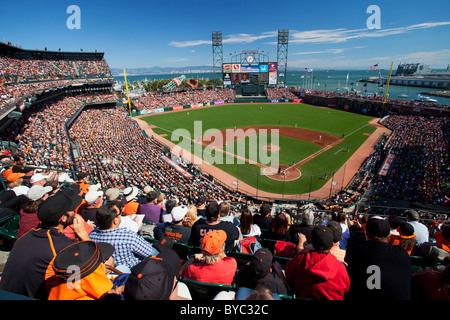 San Francisco Giants major league assistant coach Alyssa Nakken (92) sits  on the bench before a baseball game against the Atlanta Braves Saturday,  Aug. 28, 2021, in Atlanta. (AP Photo/John Bazemore Stock