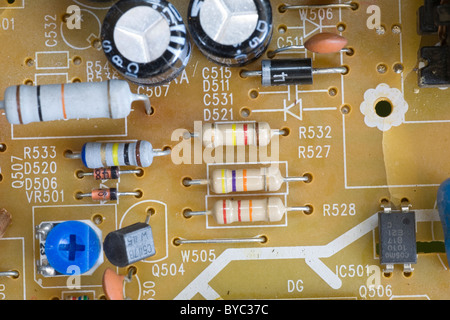 Resistors, diodes and components on an electronic circuit board. Stock Photo