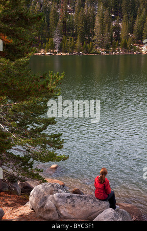 A hiker stops a Marlette Lake on the Flume Trail, Lake Tahoe, NV (model released) Stock Photo