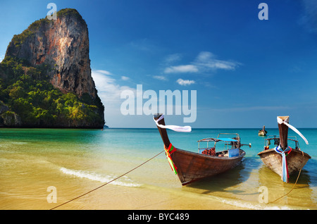 Tropical beach, traditional long tail boats, Andaman Sea, Thailand Stock Photo