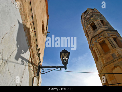 Minaret and streetlight with shadows in Sousse medina, Tunisia Stock Photo