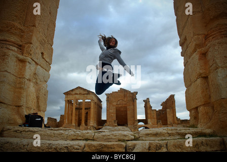 Tourist at the Roman ruins of Sbeitla, Tunisia Stock Photo