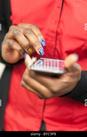 Close-up of person using a touch screen smart phone Stock Photo