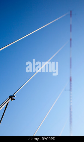 Guyed type telecommunication mast ' s guy wires ( stays or guys )  support the mast , Finland Stock Photo