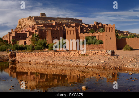 Red Ait Benhaddou ancient city reflected in the water of Ounila River or Wadi Mellah near Ouarzazate Morocco Stock Photo