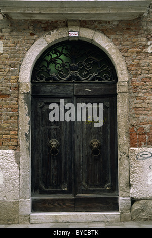 An arched doorway on a street in Venice, Italy Stock Photo