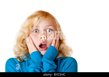 Young beautiful girl looks shocked into camera. Isolated on white. Stock Photo