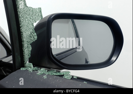 Car window broken during car theft Stock Photo