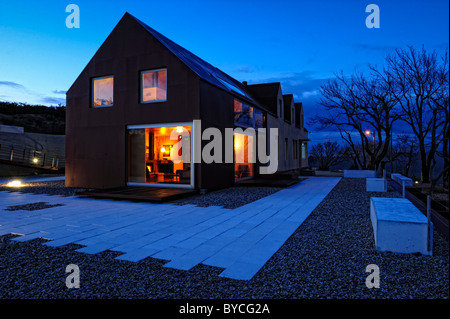 Dusk view of a minimalist modern house based on the traditional Serra da Estrela houses in Portugal Stock Photo
