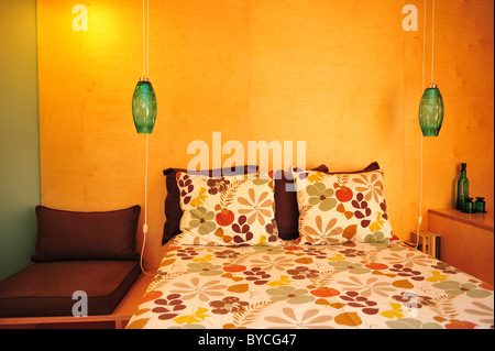 Suspended bedside green glass lamps Stock Photo