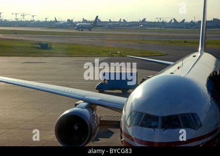 Aeroplanes parked on the tarmac at Heathrow Airport, London, England. Stock Photo