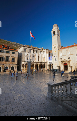 The clock tower and The Sponza Palace on Luza square in the old town, Dalmatian coast, Dubrovnik, historic center, Croatia Stock Photo