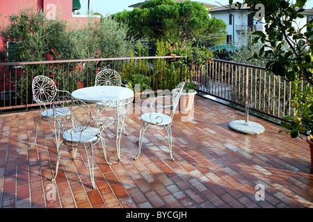 table and chairs on a balcony Stock Photo