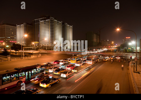 Beijing traffic at night at the junction of Jianguomen Inner Street and East Chang'an Street. JMH4783 Stock Photo