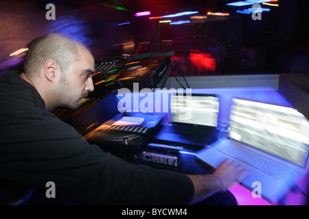 Dj using his laptop. Stock Photo
