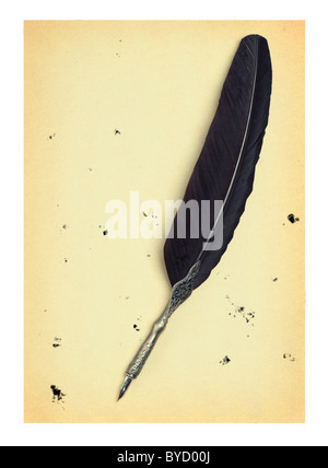 Feather quill on an old paper. Isolated on white.Drops of the sprayed ink Stock Photo