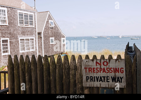 No trespassing sign in front of a beach front home, Cape Cod, Massachusetts. Stock Photo