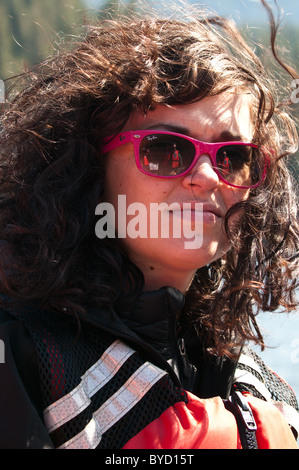 Alaska. Attractive young woman in Five Finger Islands area of Frederick Sound, Tongass National Forest. Southeast Alaska. (MR) Stock Photo