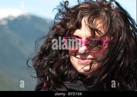 Alaska. Attractive young woman in Five Finger Islands area of Frederick Sound, Tongass National Forest. Southeast Alaska. (MR) Stock Photo