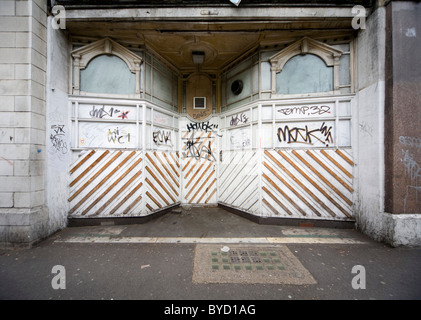 Derelict boarded up shop front on street Stock Photo