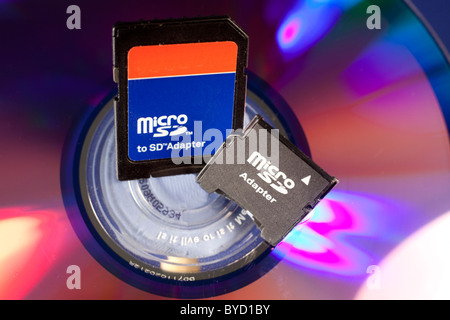 Micro SD adapters on a DVD background Stock Photo