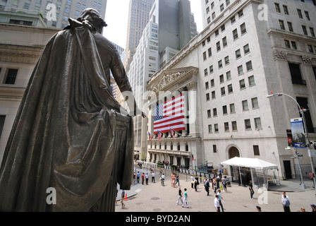 A view from Federal Hall and the Statue of George Washington looking towards the Stock Exchange on Wall Street. June 6, 2010. Stock Photo